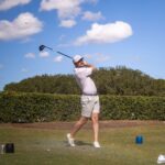 Golfer mid-swing at the 2025 Carpenter Classic