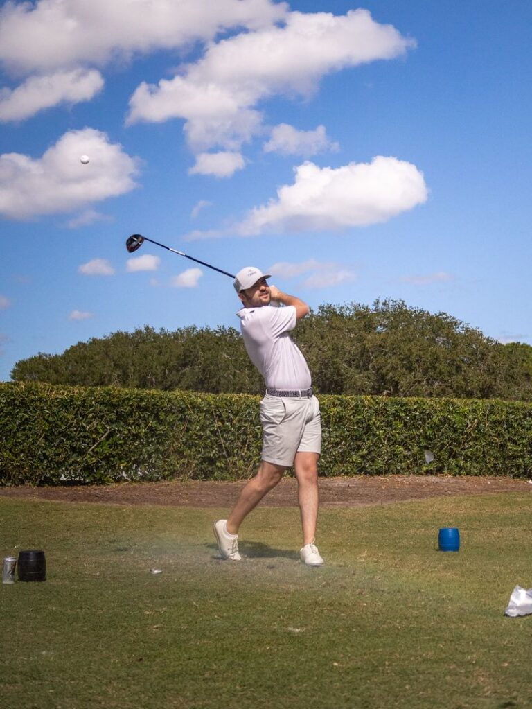 Golfer mid-swing at the 2025 Carpenter Classic